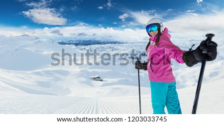 Young caucasian woman skier in European Alps. Winter sports and leasure activities