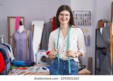 Young caucasian woman tailor smiling confident standing at tailor shop - Shutterstock ID 2292031265