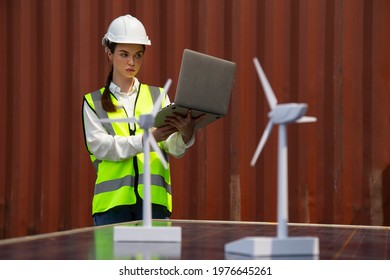 Young Caucasian Woman University Student Learning And Experimental Wind And Sunlight Renewable Energy In Engineering, Bachelor Of Science, Renewable Energy Course. Education And Energy Concept.