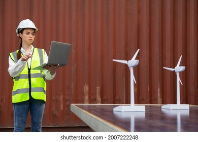 Young Caucasian Woman University Student Learning And Experimental Wind And Sunlight Renewable Energy In Engineering, Bachelor Of Science, Renewable Energy Course. Education And Energy Concept.