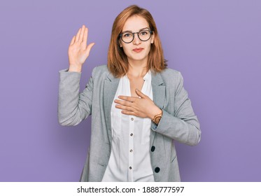 Young Caucasian Woman Wearing Business Style And Glasses Swearing With Hand On Chest And Open Palm, Making A Loyalty Promise Oath 