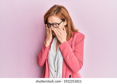 Young caucasian woman wearing business style and glasses rubbing eyes for fatigue and headache, sleepy and tired expression. vision problem 