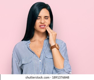 Young Caucasian Woman Wearing Casual Clothes Touching Mouth With Hand With Painful Expression Because Of Toothache Or Dental Illness On Teeth. Dentist 