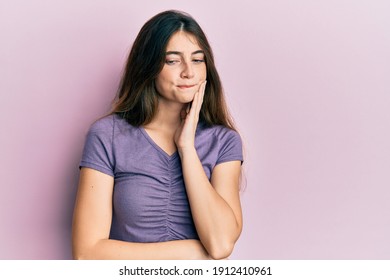 Young Caucasian Woman Wearing Casual Clothes Touching Mouth With Hand With Painful Expression Because Of Toothache Or Dental Illness On Teeth. Dentist 