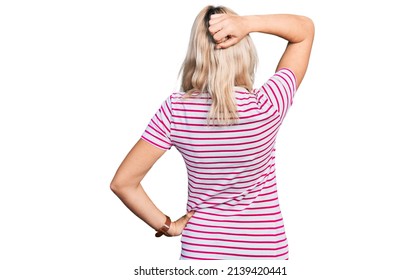 Young Caucasian Woman Wearing Casual Clothes Backwards Thinking About Doubt With Hand On Head 