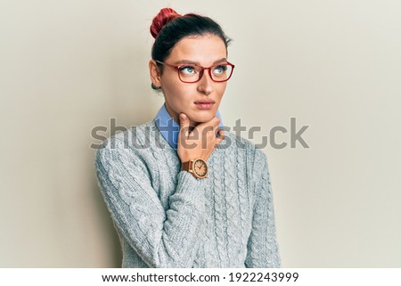 Young caucasian woman wearing casual clothes and glasses touching painful neck, sore throat for flu, clod and infection 