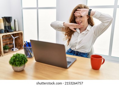 Young Caucasian Woman Working At The Office Using Computer Laptop Smiling Cheerful Playing Peek A Boo With Hands Showing Face. Surprised And Exited 