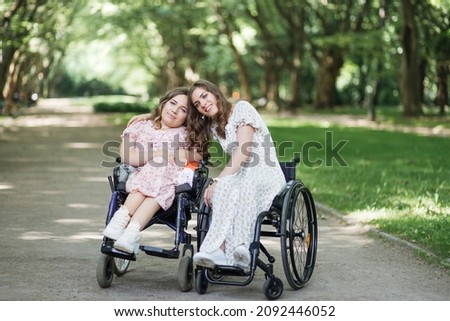 Similar – Daughter hugging senior mother in wheelchair