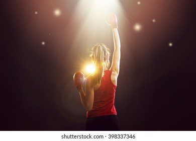 Young champion woman boxer celebrating victory 