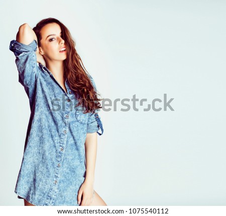 young cheerful brunette teenage girl on white background