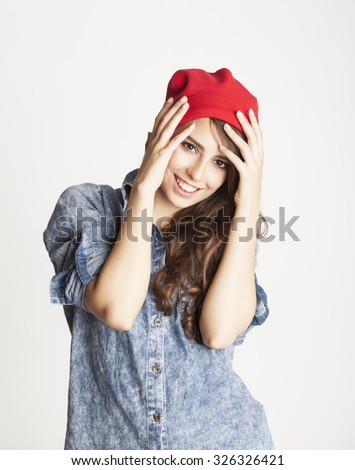 young cheerful brunette teenage girl on white background smiling