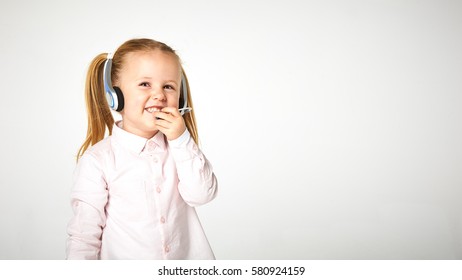 Young cheerful female customer support operator with headset and smiling - Powered by Shutterstock