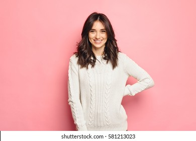 Young cheerful girl wearing winter cozy sweater