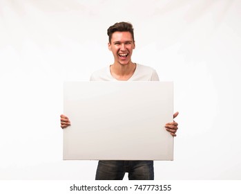 Young Man Holding Sign Studio Stock Photo (Edit Now) 1936424116