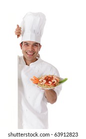 Young Cheerful Nepalese Chef Male Holding A Plate With Tasty Oriental Food. Studio Shot. White Background.