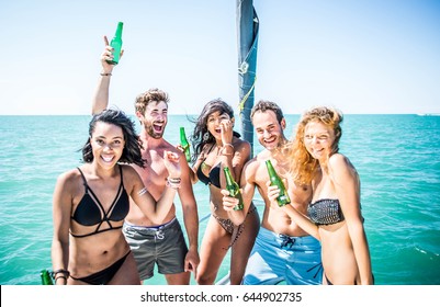 Young cheerful people having fun in boat party - Happy friends enjoying summer vacation