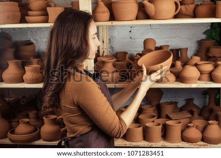 Similar – Beautiful ceramist owner looking to the camera while smiling