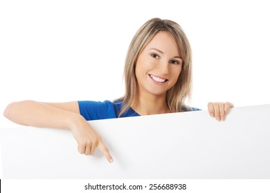 Young cheerful woman holding white banner