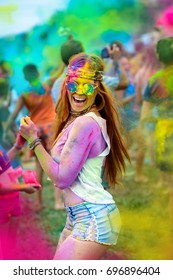 Young Cheerful Woman At Holi Paint Party