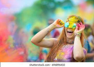 Young Cheerful Woman At Holi Paint Party