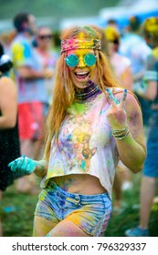 Young Cheerful Woman At Holi Paint Party