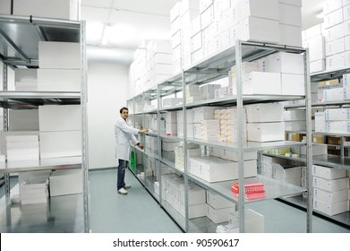 Young Cheerful Worker In Modern Warehouse