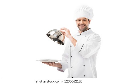 Young Chef Taking Of Serving Dome From Plate Isolated On White