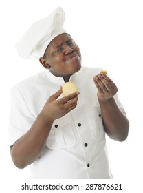 A Young Chef Taste Testing His Sugar Cookies.  His Body Language Says They're Absolutely Yummy.