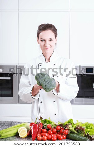 Image, Stock Photo Worker shows broccoli on plantation. Picking broccoli.