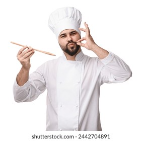 Young chef in uniform tasting something and showing perfect sign on white background - Powered by Shutterstock