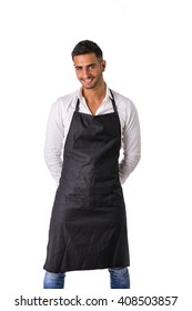 Young Chef Or Waiter Wearing Black Apron Isolated