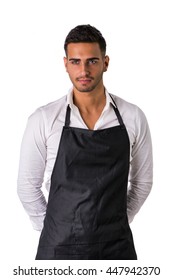 Young Chef Or Waiter Wearing Black Apron Isolated