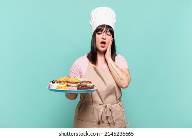 Young Chef Woman Feeling Happy, Excited And Surprised, Looking To The Side With Both Hands On Face