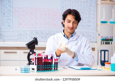 Young chemist working in the lab 