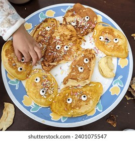 young child with birthday pancakes - Powered by Shutterstock