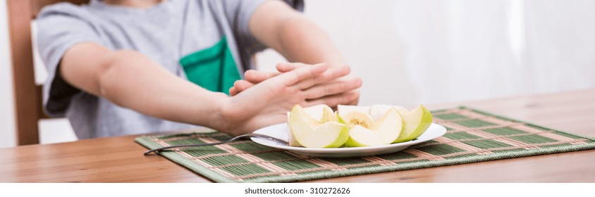 Young Child Does Not Like Eating An Apple