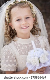 A Young Child Doing Her First Holy Communion