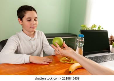 Young Child Eating Stealthily High Calorie Foods. Prescribing Diet For Overweight Fat Patient. Health Problem, Weight Loss. Doctor Advising A Fat Boy To Eat Healthy.Doctor Warning Of Consequences.