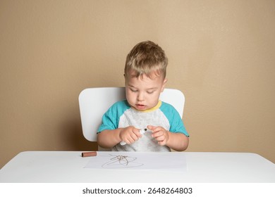 Young child exploring creativity with marker