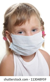 Young Child Girl In Medical Mask Isolated Over White