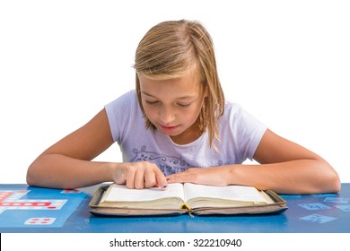 Young Child Girl Reading And Study Holy Bible At Blue Desk In Church Sunday School