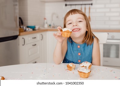 Young Child The girl smiles, rejoices at the cake, offers it. Concept friendship, share, treat. - Powered by Shutterstock