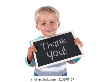 Young child holding thank you sign standing against white background