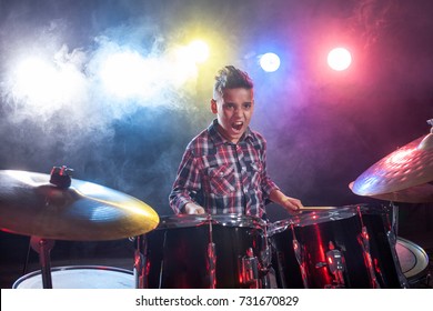 Young Child Musician Playing The Drums 