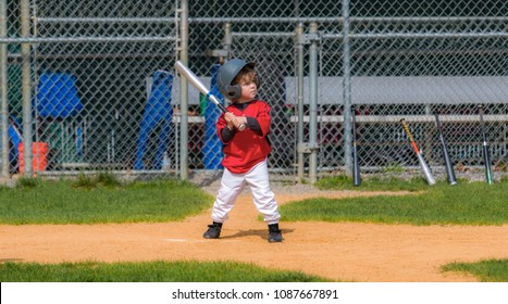 Young Child Playing Baseball 
