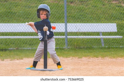 Young Child Playing Baseball