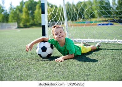 Young child playing football