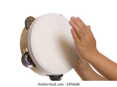 A Young Child Plays Her Tambourine