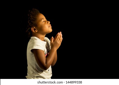 A Young Child Prays To God.