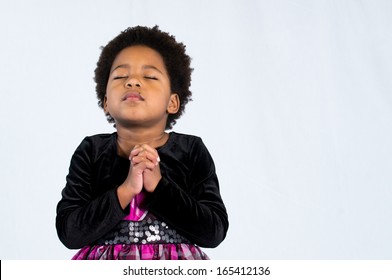 A Young Child Prays To God.